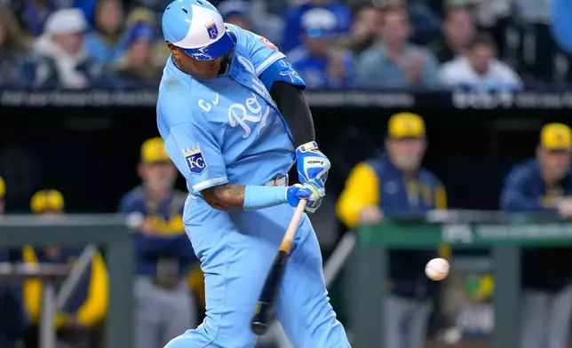 Kansas City Royals' Salvador Perez hits a solo home run during the sixth inning in the second baseball game of a doubleheader against the Milwaukee Brewers, Saturday, April 4, 2026, in Kansas City, Mo. (AP Photo/Charlie Riedel)
