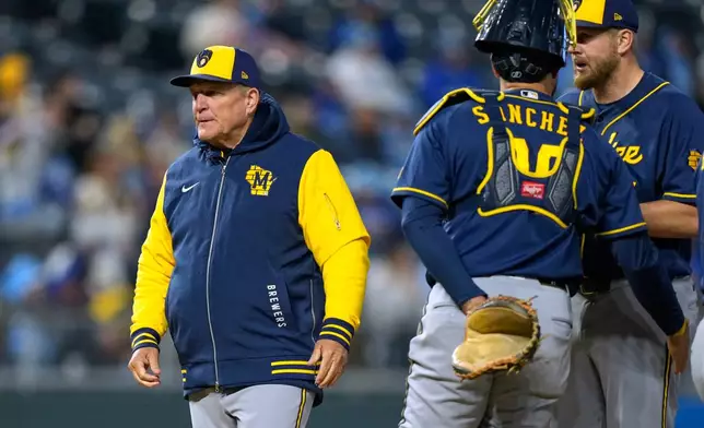 Milwaukee Brewers manager Pat Murphy walks back to the dugout after making a pitching change during the sixth inning in the second baseball game of a doubleheader against the Kansas City Royals, Saturday, April 4, 2026, in Kansas City, Mo. (AP Photo/Charlie Riedel)