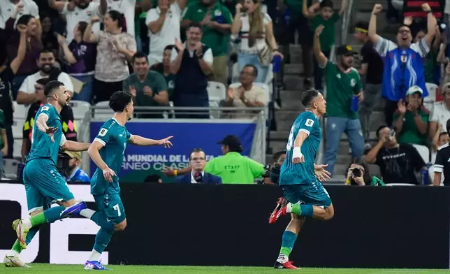 Iraq's Ali Al-Hamadi, right, celebrates scoring his side's opening goal during the World Cup playoff final soccer match between Iraq and Bolivia in Monterrey, Mexico, Tuesday, March 31, 2026. (AP Photo/Fernando Llano)