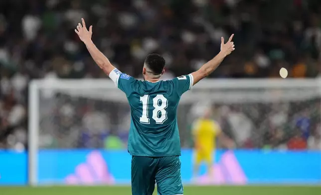 Iraq's Aymen Hussein celebrates scoring his side's 2nd goal during the World Cup playoff final soccer match between Iraq and Bolivia in Monterrey, Mexico, Tuesday, March 31, 2026. (AP Photo/Fernando Llano)