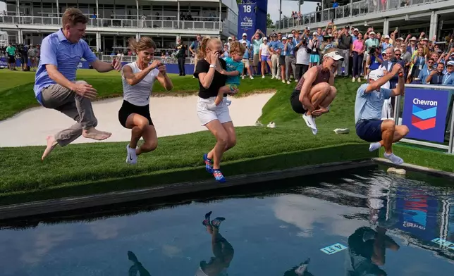 Nelly Korda celebrates by jumping in the water after winning the Chevron Championship LPGA golf tournament Sunday, April 26, 2026, in Houston. (AP Photo/Ashley Landis)
