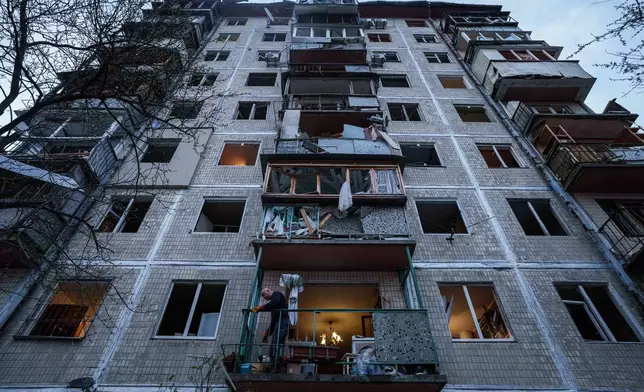 A man clears the rubble inside his house damaged after a Russian strike on residential neighbourhood in Kyiv, Ukraine, on Thursday, April 16, 2026. (AP Photo/Evgeniy Maloletka)