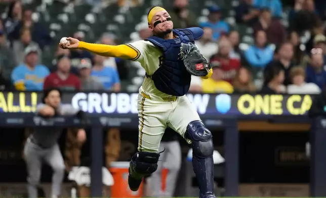 Milwaukee Brewers catcher William Contreras throws out Arizona Diamondbacks' Ildemaro Vargas at first during the fifth inning of a baseball game Tuesday, April 28, 2026, in Milwaukee. (AP Photo/Nam Y. Huh)