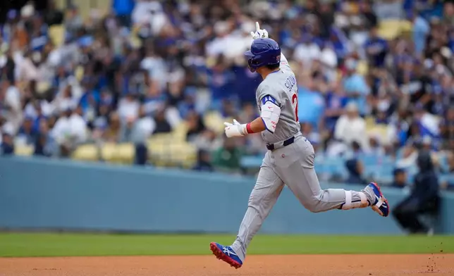 Chicago Cubs Seiya Suzuki gestures after hitting a solo home run during the second inning of a baseball game against the Los Angeles Dodgers, Saturday, April 25, 2026, in Los Angeles. (AP Photo/Mark J. Terrill)