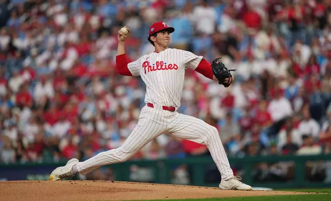 Philadelphia Phillies' Andrew Painter pitches during the first inning of a baseball game against the Washington Nationals, Tuesday, March 31, 2026, in Philadelphia. (AP Photo/Matt Rourke)