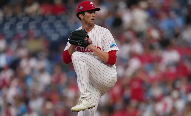 Philadelphia Phillies' Andrew Painter pitches during the first inning of a baseball game against the Washington Nationals, Tuesday, March 31, 2026, in Philadelphia. (AP Photo/Matt Rourke)
