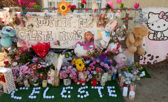 FILE - A makeshift Memorial for Celeste Rivas Hernandez, who was killed and found inside a vehicle owned by singer D4vd, is placed outside her home in Lake Elsinore, Calif., on April 21, 2026. (AP Photo/Damian Dovarganes, file)