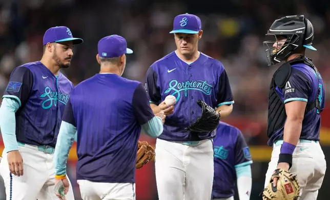Arizona Diamondbacks pitcher Paul Sewald (38) is relieved from pitching after allowing two home runs during a baseball game against the Atlanta Braces, Friday, April 3, 2026, in Phoenix. (AP Photo/Rebecca Noble)
