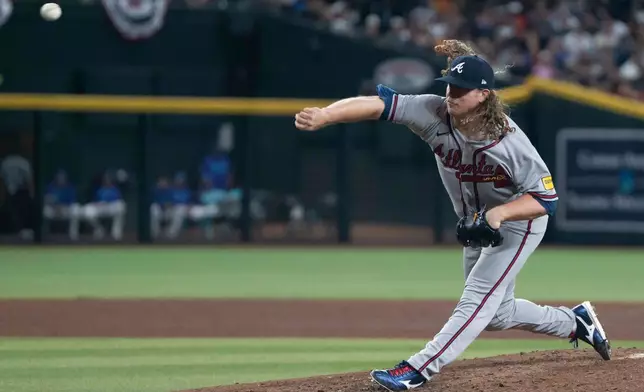 Atlanta Braves pitcher Grant Holmes (66) pitches during a baseball game against the Arizona Diamondbacks, Friday, April 3, 2026, in Phoenix. (AP Photo/Rebecca Noble)