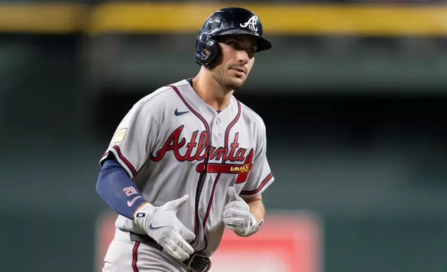 Atlanta Braves first baseman Matt Olson (28) rounds the bases after hitting a home run during the ninth inning of a baseball game against the Arizona Diamondbacks, Friday, April 3, 2026, in Phoenix. (AP Photo/Rebecca Noble)