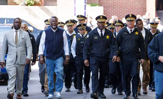 Mayor Brandon Johnson and Chicago Police Dept. Superintendent Larry Snelling are joined by other officials as they walk to address media outside of Illinois Masonic Hospital Advance Care in Lake View after a shooting Saturday, April 25, 2026, in Chicago. (Anthony Vazquez/Chicago Sun-Times via AP)