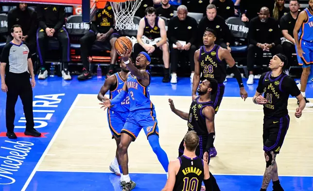 Oklahoma City Thunder guard Shai Gilgeous-Alexander (2) shoots against Los Angeles Lakers guard Bronny James (9) during the second half of an NBA basketball game Thursday, April 2, 2026, in Oklahoma City. (AP Photo/Gerald Leong)