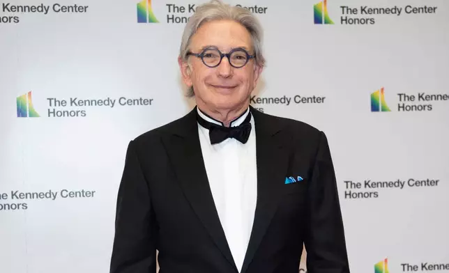 FILE - 2019 Kennedy Center Honoree conductor Michael Tilson Thomas arrives at the State Department for the Kennedy Center Honors in Washington on Dec. 7, 2019. (AP Photo/Kevin Wolf, File)