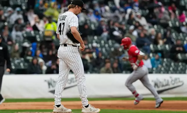 Chicago White Sox starting pitcher Erick Fedde looks down after Los Angeles Angels' Mike Trout hit a solo home run during the fourth inning of a baseball game in Chicago, Wednesday, April 29, 2026. (AP Photo/Nam Y. Huh)