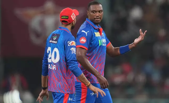 Delhi Capitals' Lungi Ngidi, right, listens to captain Axar Patel before bowling his next delivery during the Indian Premier League cricket match between Lucknow Super Giants and Delhi Capitals in Lucknow, India, Wednesday, April 1, 2026. (AP Photo/Manish Swarup)