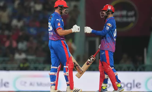 Delhi Capitals' Sameer Rizvi, right, and batting partner Tristan Stubbs encourage each other during the Indian Premier League cricket match between Lucknow Super Giants and Delhi Capitals in Lucknow, India, Wednesday, April 1, 2026. (AP Photo/Manish Swarup)