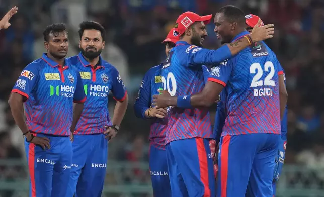Delhi Capitals' Lungi Ngidi, right, celebrates with teammates the dismissal of Lucknow Super Giants' Nicholas Pooran during the Indian Premier League cricket match between Lucknow Super Giants and Delhi Capitals in Lucknow, India, Wednesday, April 1, 2026. (AP Photo/Manish Swarup)