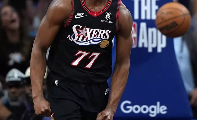 Philadelphia 76ers' VJ Edgecombe reacts after a dunk during the first half of Game 3 against the Boston Celtics in a first-round NBA playoffs basketball series Friday, April 24, 2026, in Philadelphia. (AP Photo/Matt Slocum)