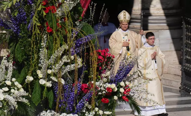 Pope Leo XIV arrives to preside over Easter Mass in St. Peter's Square at the Vatican, Sunday, April 5, 2026 (AP Photo/Alessandra Tarantino)