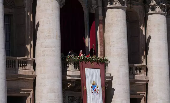 Pope Leo XIV addresses the faithful after delivering the Urbi et Orbi blessing - Latin for "to the city of Rome and to the world" - from the central loggia of St. Peter's Basilica at the end of Easter Mass he presided over in St. Peter's Square at the Vatican, Sunday, April 5, 2026. (AP Photo/Alessandra Tarantino)