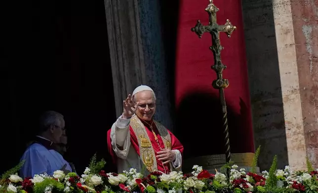 Pope Leo XIV addresses the faithful after delivering the Urbi et Orbi blessing - Latin for "to the city of Rome and to the world" - from the central loggia of St. Peter's Basilica at the end of Easter Mass he presided over in St. Peter's Square at the Vatican, Sunday, April 5, 2026. (AP Photo/Alessandra Tarantino)