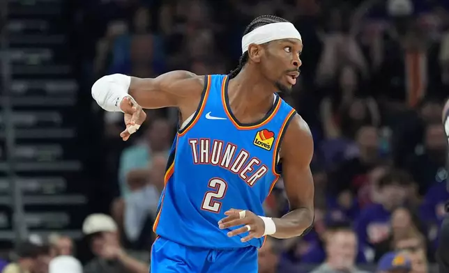 Oklahoma City Thunder guard Shai Gilgeous-Alexander celebrates a 3-pointer against the Phoenix Suns during the first half of Game 3 of a first-round NBA playoffs basketball series, Saturday, April 25, 2026, in Phoenix. (AP Photo/Ross D. Franklin)