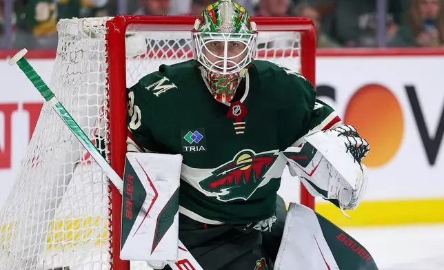 Minnesota Wild goaltender Jesper Wallstedt defends his net against the Dallas Stars during the second period of Game 4 in the first round of the NHL Stanley Cup hockey playoffs Saturday, April 25, 2026, in St. Paul, Minn. (AP Photo/Matt Krohn)