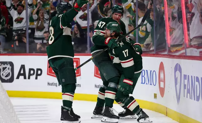 Minnesota Wild left wing Marcus Foligno celebrates his goal against the Dallas Stars during the third period of Game 4 in the first round of the NHL Stanley Cup hockey playoffs Saturday, April 25, 2026, in St. Paul, Minn. (AP Photo/Matt Krohn)