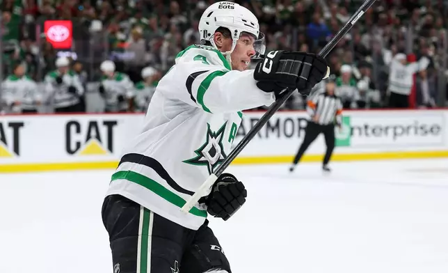 Dallas Stars defenseman Miro Heiskanen celebrates after his goal against the Minnesota Wild during the second period of Game 4 in the first round of the NHL Stanley Cup hockey playoffs Saturday, April 25, 2026, in St. Paul, Minn. (AP Photo/Matt Krohn)