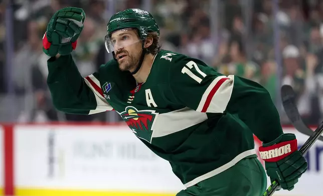 Minnesota Wild left wing Marcus Foligno celebrates his goal against the Dallas Stars during the third period of Game 4 in the first round of the NHL Stanley Cup hockey playoffs Saturday, April 25, 2026, in St. Paul, Minn. (AP Photo/Matt Krohn)