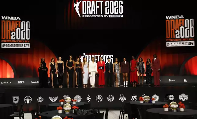 WNBA prospects pose on stage before the WNBA basketball draft Monday, April 13, 2026, in New York. (AP Photo/Pamela Smith)