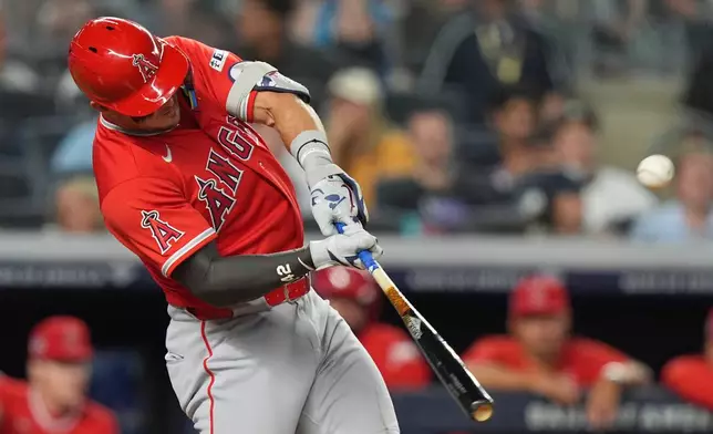 Los Angeles Angels' Mike Trout hits a two-run home run during the fifth inning of a baseball game against the New York Yankees Wednesday, April 15, 2026, in New York. (AP Photo/Frank Franklin II)