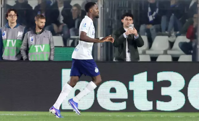 Inter Milan's Marcus Thuram celebrates during the Serie A soccer match between Como and Inter, in Como, Italy, Sunday, April 12, 2026. (Antonio Saiai/LaPresse via AP)