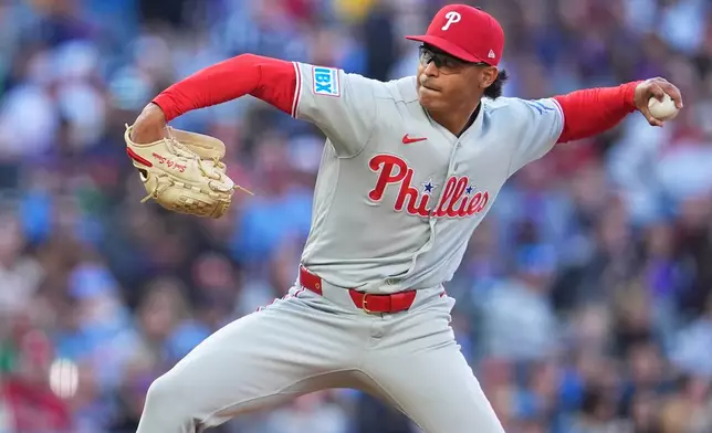 Philadelphia Phillies relief pitcher Jesús Luzardo works against the Colorado Rockies in the first inning of a baseball game Saturday, April 4, 2026, in Denver. (AP Photo/David Zalubowski)