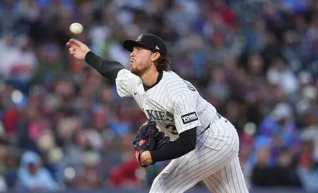 Colorado Rockies relief pitcher Chase Dollander works against the Philadelphia Phillies in the fifth inning of a baseball game Saturday, April 4, 2026, in Denver. (AP Photo/David Zalubowski)