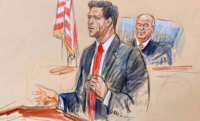 This courtroom sketch depicts defense attorney Geremy Kamens speaking as Judge Anthony J. Trenga listens during the opening day of the trial for alleged Islamic State militant Mohammad Sharifullah in federal court in Alexandria, Va., Monday, April 20, 2026. (Dana Verkouteren via AP)