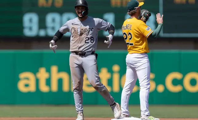Chicago White Sox' Everson Pereira (28) celebrates after hitting a double during the sixth inning of a baseball game against the Athletics, Saturday, April 18, 2026, in West Sacramento, Calif. (AP Photo/Sara Nevis)