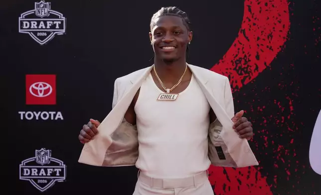 Ohio State wide receiver Carnell Tate poses on the red carpet before the first round of the NFL football draft, Thursday, April 23, 2026, in Pittsburgh. (AP Photo/Gene J. Puskar)
