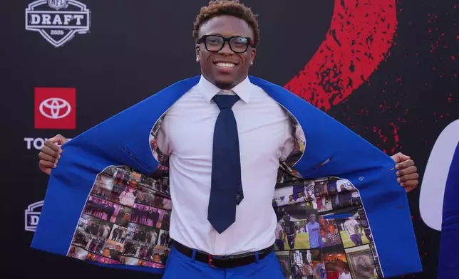 Tennessee defensive back Colton Hood poses on the red carpet before the first round of the NFL football draft, Thursday, April 23, 2026, in Pittsburgh. (AP Photo/Gene J. Puskar)