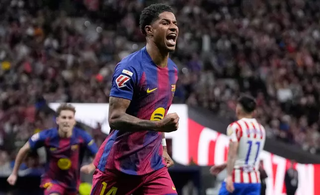 Barcelona's Marcus Rashford celebrates after scoring his sides first goal during a La Liga soccer match between Atletico Madrid and Barcelona in Madrid, Spain, Saturday, April 4, 2026. (AP Photo/Bernat Armangue)