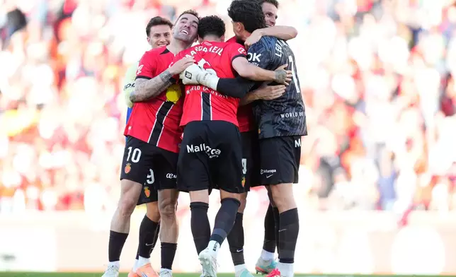 Mallorca players celebrate after a La Liga soccer match between Mallorca and Real Madrid in Palma de Mallorca, Spain, Saturday, April 4, 2026. (AP Photo/Jose Breton)