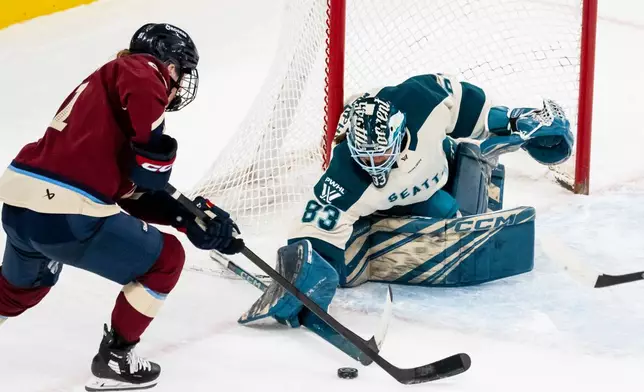 Seattle Torrent goaltender Hannah Murphy (83) makes a save on Montreal Victoire's Maggie Flaherty (91) during third period PWHL hockey action in Laval, Que., on Tuesday, April 7, 2026. (Christopher Katsarov/The Canadian Press via AP)