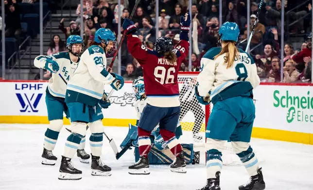 Montreal Victoire's Natalie Mlynkova (96) celebrates after scoring on Seattle Torrent goaltender Hannah Murphy (83), during the second period of a PWHL hockey gamen in Laval, Que., on Tuesday, April 7, 2026. (Christopher Katsarov/The Canadian Press via AP)