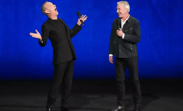 Tom Hanks, left, and Tim Allen, cast members of the upcoming film "Toy Story 5," speak during the Walt Disney Studios presentation at CinemaCon on Thursday, April 16, 2026, at Caesars Palace in Las Vegas. (AP Photo/Chris Pizzello)