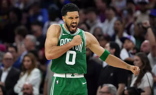 Boston Celtics' Jayson Tatum reacts after scoring during the second half of Game 3 against the Philadelphia 76ers in a first-round NBA playoffs basketball series Friday, April 24, 2026, in Philadelphia. (AP Photo/Matt Slocum)