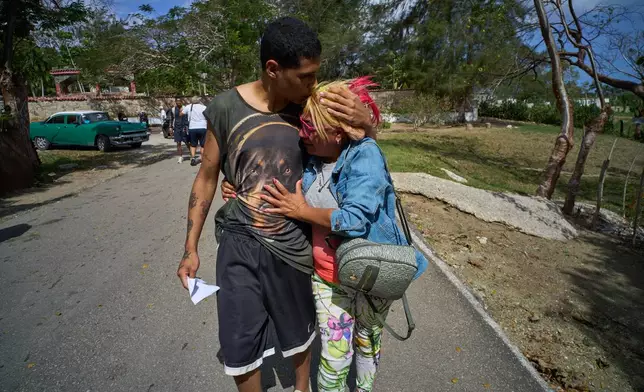 A pardoned prisoner kisses a family member after his release from La Lima penitentiary in Guanabo, Cuba, Friday, April 3, 2026. (AP Photo/Ramon Espinosa)