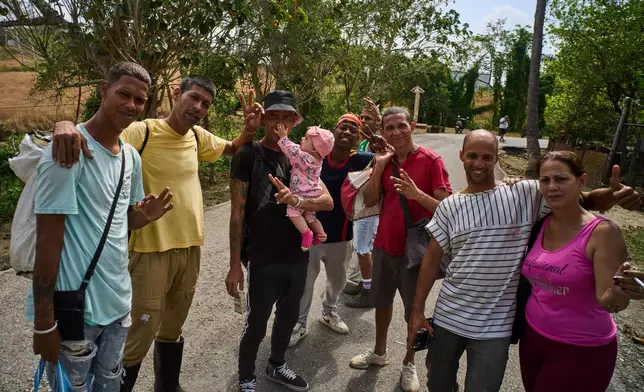 Formerly imprisoned men who were pardoned pose for a photo after their release from La Lima penitentiary in Guanabo, Cuba, Friday, April 3, 2026. (AP Photo/Ramon Espinosa)