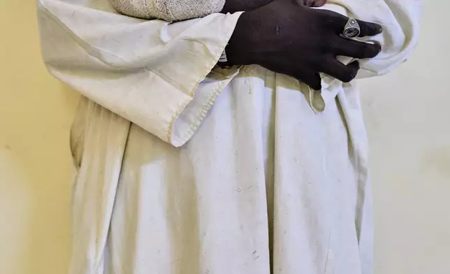 Mogadem Ibrahim, 18, who was injured in an explosion caused by unexploded ordnance, waits for treatment at Al Nao Hospital in Omdurman, on the outskirts of Khartoum, Saturday, April 18, 2026. (AP Photo/Bernat Armangue)