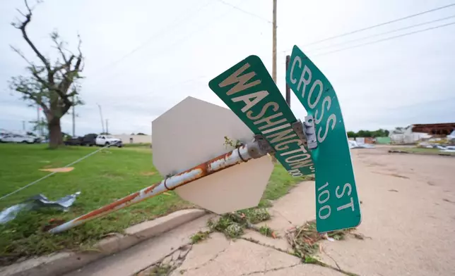 A downed street sign is visible following a storm in Mineral Wells, Texas, Wednesday, April 29, 2026. (AP Photo/Julio Cortez)