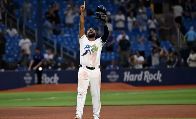 Tampa Bay Rays' Junior Caminero celebrates after they beat the Minnesota Twins during a baseball game Friday, April 24, 2026, in St. Petersburg, Fla. (AP Photo/Jason Behnken)